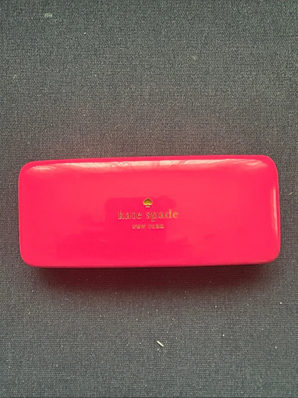 kate spade glossy hot pink eyeglass case with gold logo
